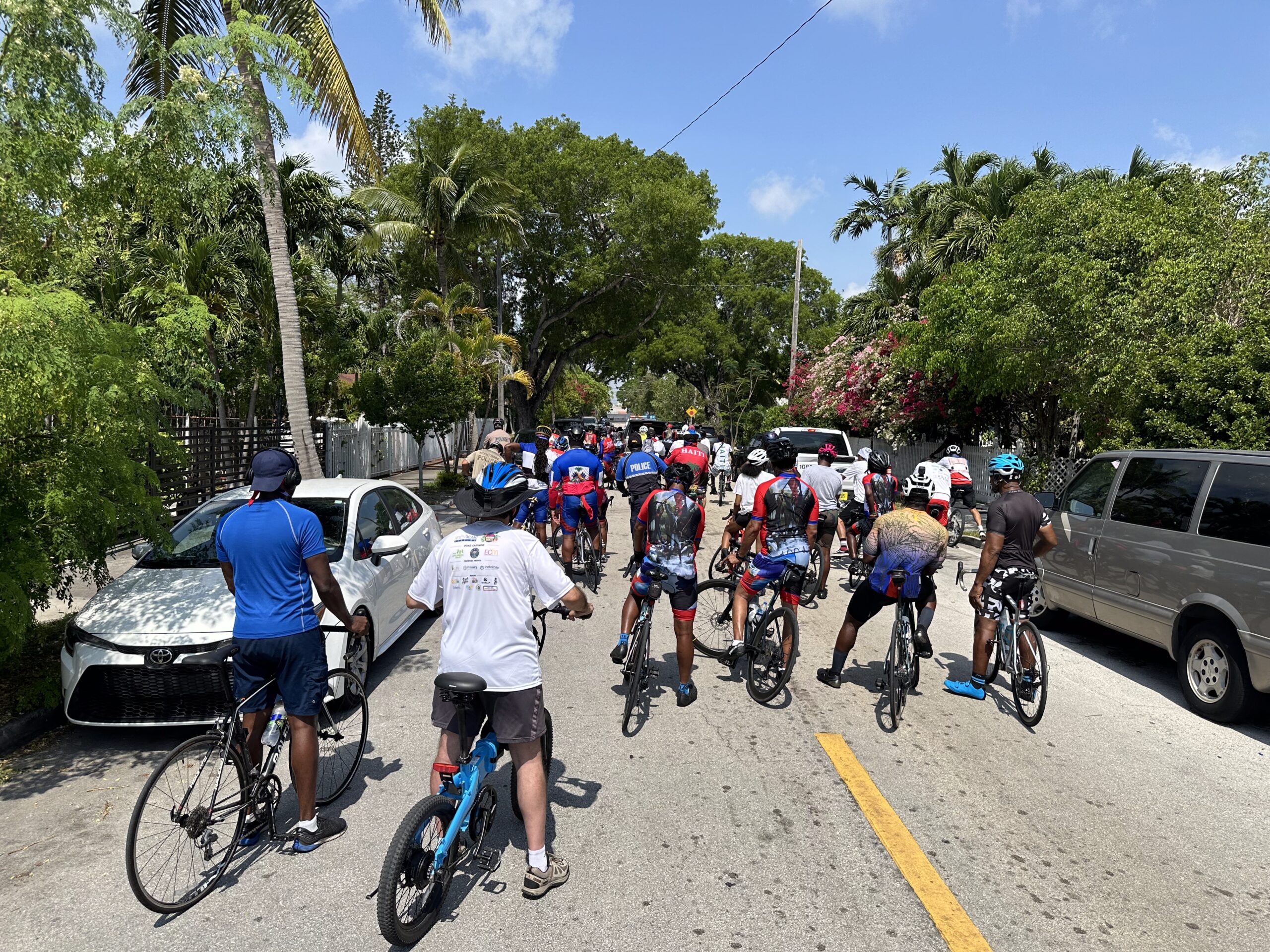 A group of people on their bicycles participating in the Pedalé 1804 Haitian Heritage Month Bike Ride
