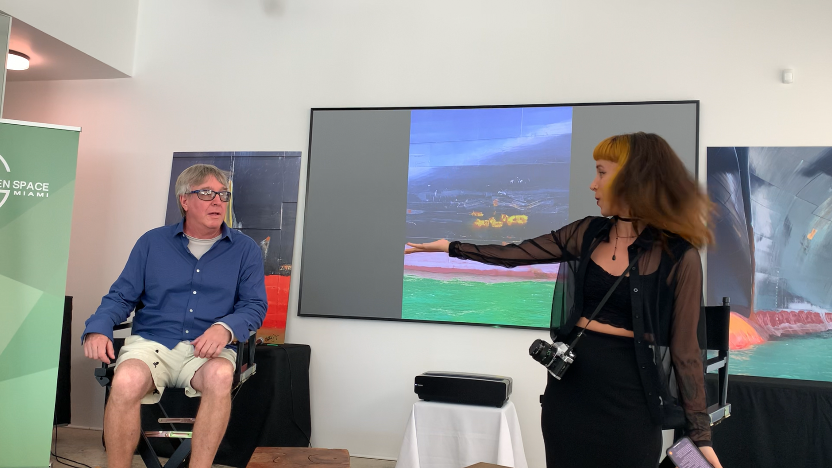 Paola Rodrigez intorducing Matt Argondizza at the PhotoTalk305 event